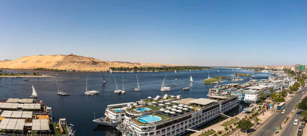 Aswan A high angle view of Aswan and the Nile river looking to the north. The Aga khan Mausoleum and Sahara Desert are to the left Nile Crusie stock pictures, royalty-free photos & images