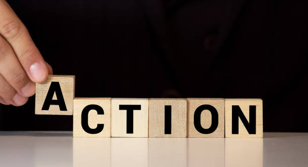 istock Action word written on wood block. Action text on table, concept. 1270864140