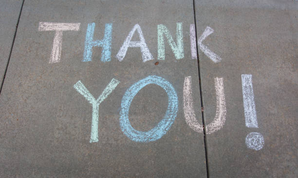 Thank you written with sidewalk chalk