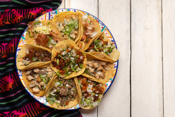 istock Assortment of mexican tacos on white background 1270865792
