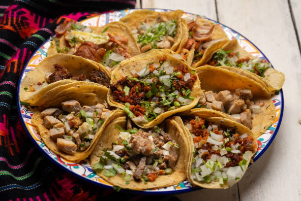 istock Assortment of mexican tacos on white background 1270866474