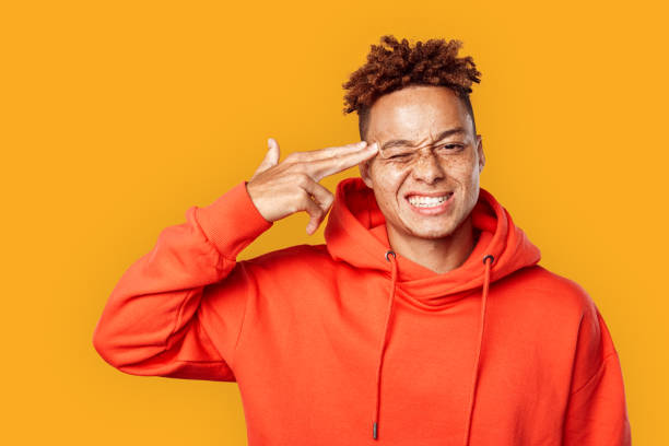 istock Young adult a showing gun, looking at camera 1270868697