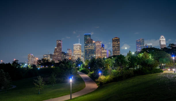 istock Downtown Houston Architecture at Night With Mostly Clear Skies 1270870044
