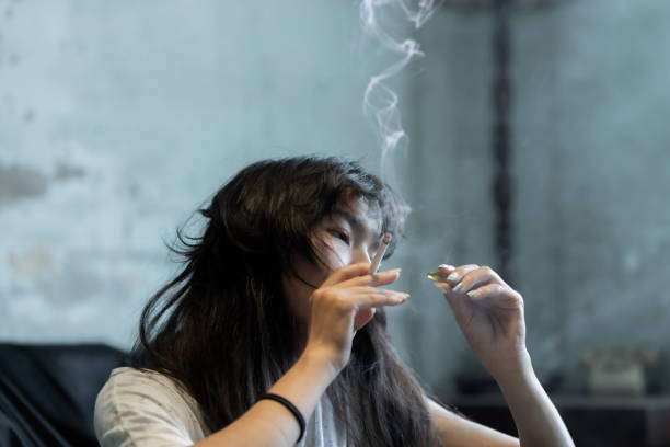 istock Asian girl smoking and feeling be absent-minded 1270876141
