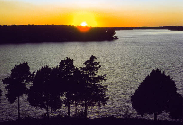 Lake of the Ozarks - Lake at Sunset  1974 Lake of the Ozarks - Lake at Sunset  1974. Scanned from Kodachrome slide. 1974 photos stock pictures, royalty-free photos & images