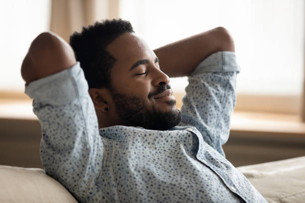 istock Close up peaceful African American man relaxing on cozy couch 1270879789