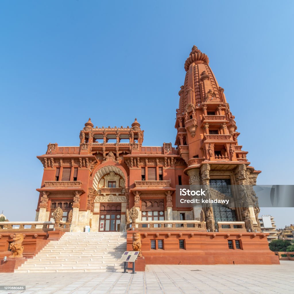 Baron Empain Palace, a historic mansion inspired by the Cambodian Hindu temple of Angkor Wat, Cairo Low angle view of front facade of Baron Empain Palace, a historic mansion inspired by the Cambodian Hindu temple of Angkor Wat, located in Heliopolis district, Cairo, Egypt Baron Empain Palace Stock Photo