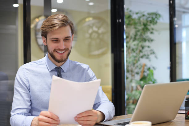 istock Successful entrepreneur is studying documents with attentive and concentrated look. 1270891968