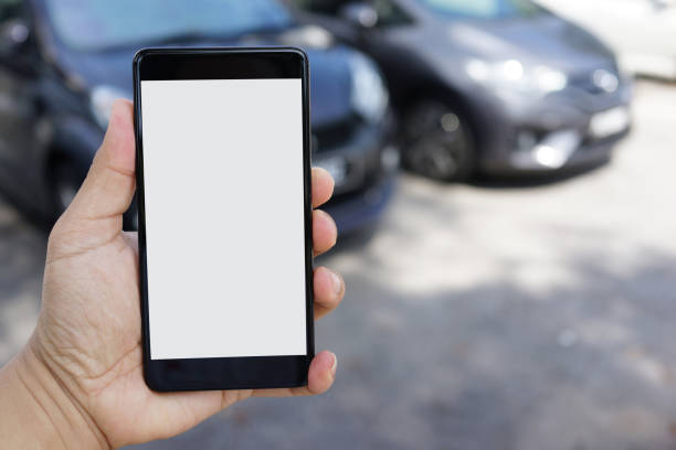istock Man using smartphone while walking to his car at outdoor carpark 1270892700