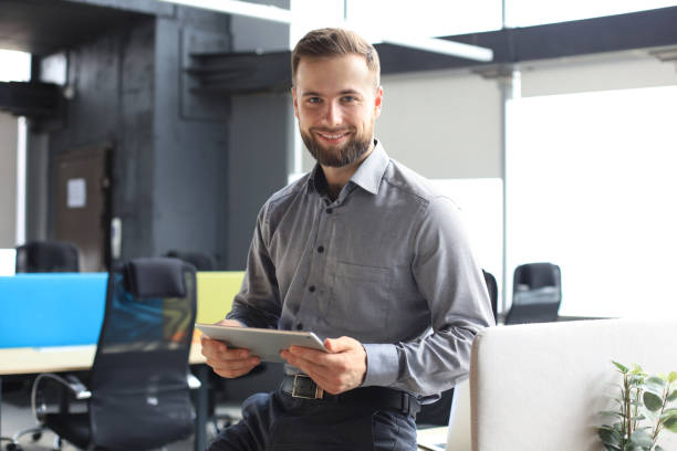 istock Young businessman using his tablet in the office. 1270892713