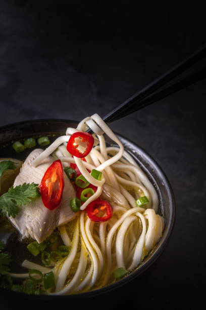 istock Close-up of taking asian soup by chopsticks 1270892723