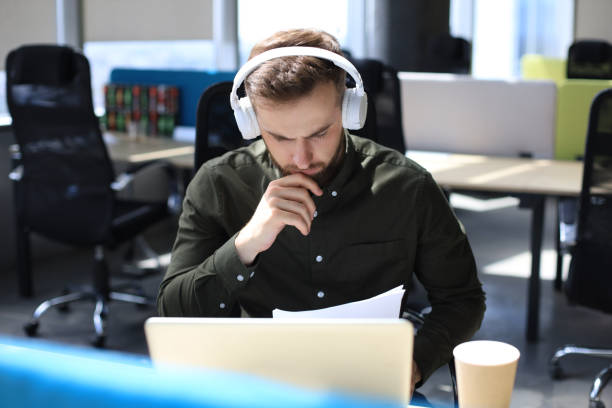 istock Successful entrepreneur is studying documents with attentive and concentrated look. 1270892738