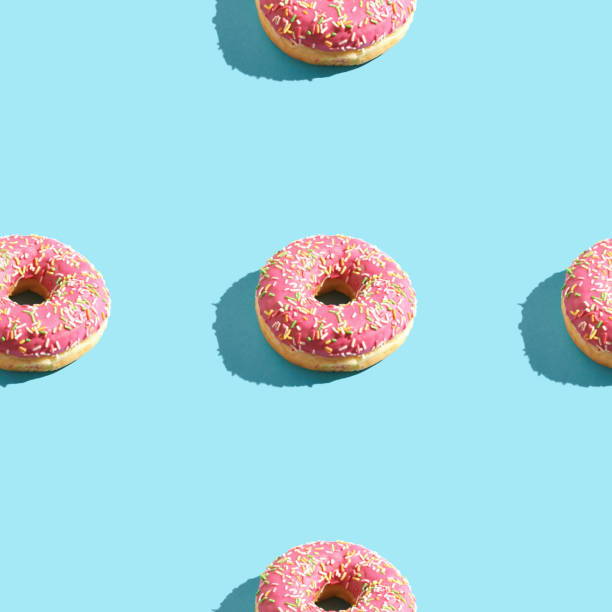 istock doughnut seamless pattern. Bright color. Tasty unhealthy food 1270892773