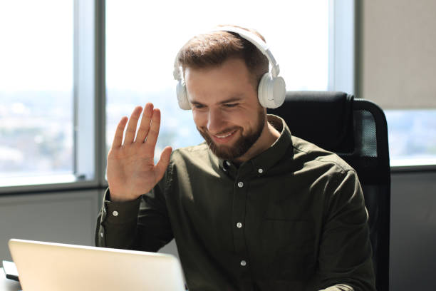 istock Smiling young business man having video call in office. 1270892789