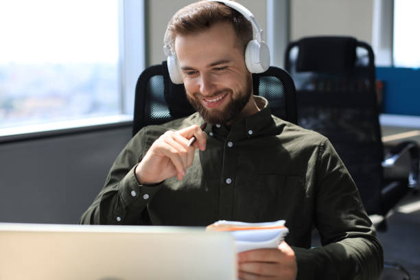 istock Smiling young business man having video call in office. 1270893068