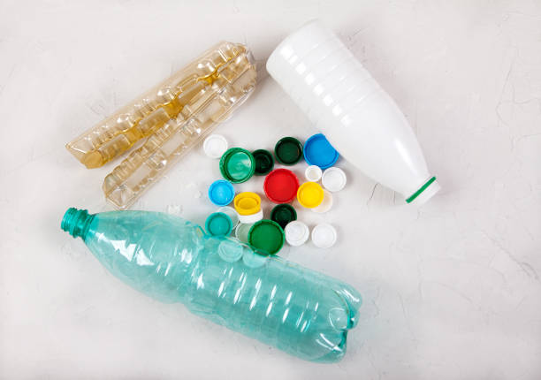 istock Garbage, waste from plastic bottles and caps on a concrete white background. Zero waste, ecology, environmental protection. 1270896866