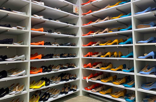 colorful shelf of high heels shoes