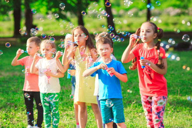 istock The Group of children blowing soap bubbles. 1270902761