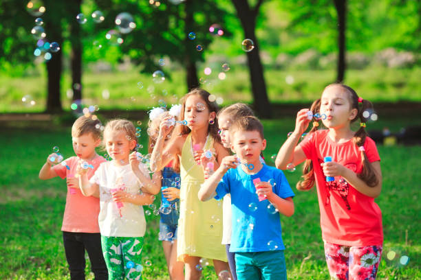 istock The Group of children blowing soap bubbles. 1270902790
