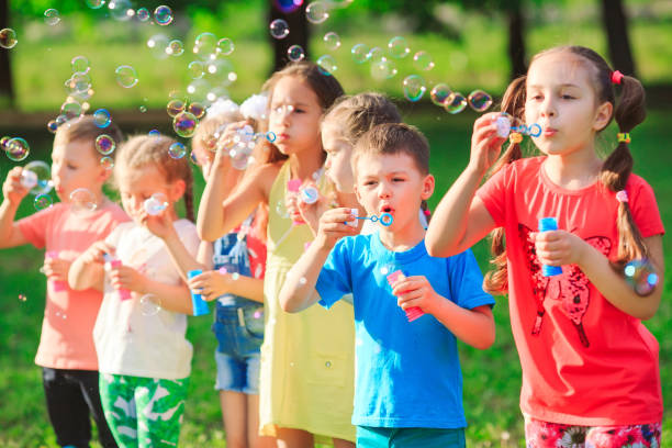 istock The Group of children blowing soap bubbles. 1270902801