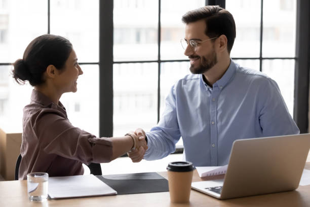 istock Diverse young business people making agreement in office. 1270913380