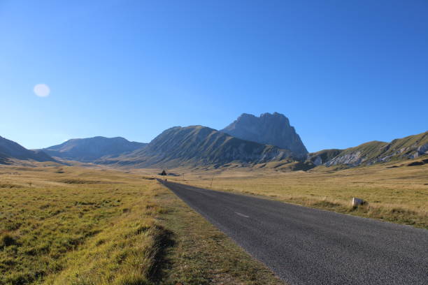 istock Lonely road in mountain 1270913823