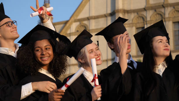 istock Graduate students taking selfie after the graduation 1270914096