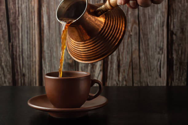 istock Hot turkish coffee pot on wooden table. aroma drink beverage 1270915233