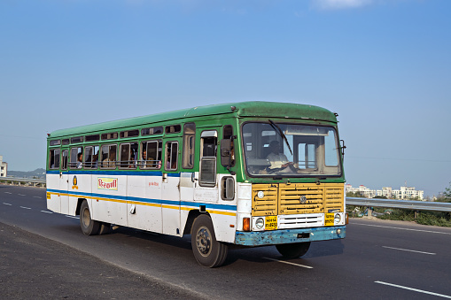 Pune, Maharashtra, India- October 25th, 2016: State tranport bus on highway.