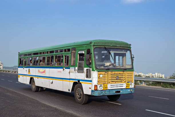 State tranport bus on highway. Pune, Maharashtra, India- October 25th, 2016: State tranport bus on highway. train air conditioner stock pictures, royalty-free photos & images