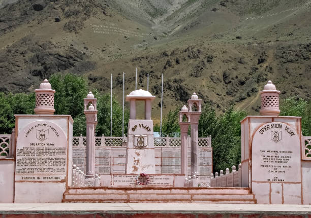 Memorial built for remembrance of India's win in Kargil War, called as Operation Vijay memorial on the background of Tololing hills and nice sky. Kargil, Jammu and Kashmir-June 27th, 2011: Close up view of Memorial built for remembrance of India's win in Kargil War, called as Operation Vijay memorial on the background og Tololing hill. tiger hill stock pictures, royalty-free photos & images