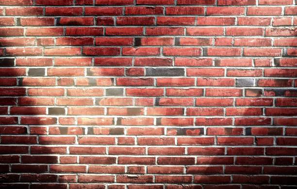 istock Aged and weathered brick wall textures with very bright spotlight illumination 1270920665