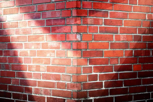 Aged and weathered brick wall textures with very bright spotlight illumination