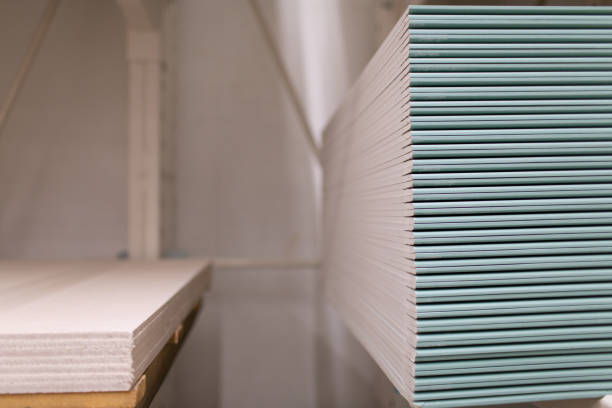 istock Pallet with Drywall sheets plasterboard in the building warehouse store. 1270922419