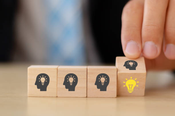 istock creative idea concept. hand man flip wooden block cube form human idea mark symbol to right light bulb symbol. vintage style 1270926072
