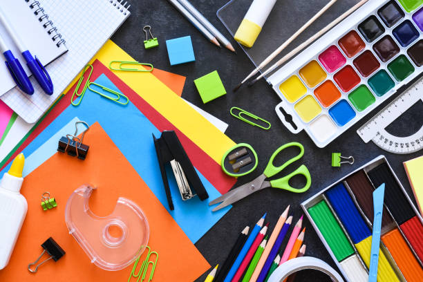 istock School supplies on a black background. Back to school concept.Flat lay composition with school stationery. 1270927317