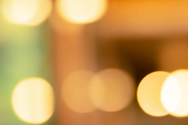 istock abstract blur of interior inside coffee cafe shop background with light effect for design element. Blurred cafe background with bokeh. orange ,red, light. 1270927369