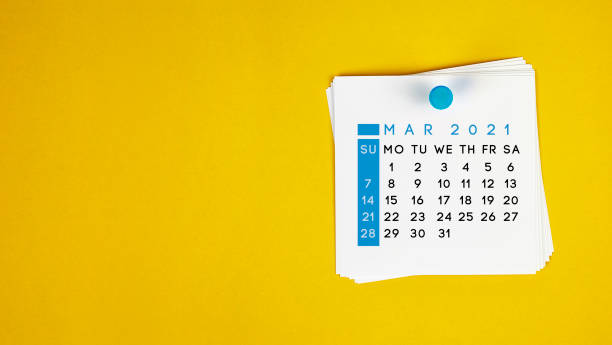 istock The March 2021 calendar is pinned on a yellow background. 1270929537