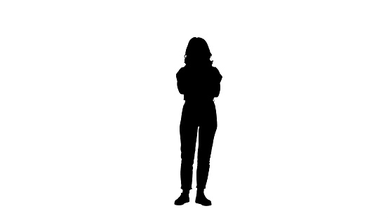 Full length shot. Silhouette Smiling young woman with her arms folded. Professional shot in 4K resolution. 006. You can use it e.g. in your commercial video, business, presentation, broadcast