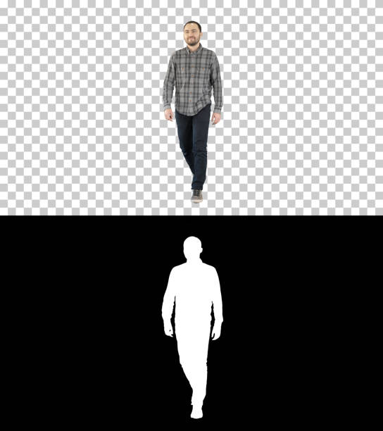 On Alpha Matte. Full length portrait. Young man walking in a good mood, Alpha Channel Professional shot in 4K resolution. 004. You can use it e.g. in your commercial video, business, presentation, broadcast