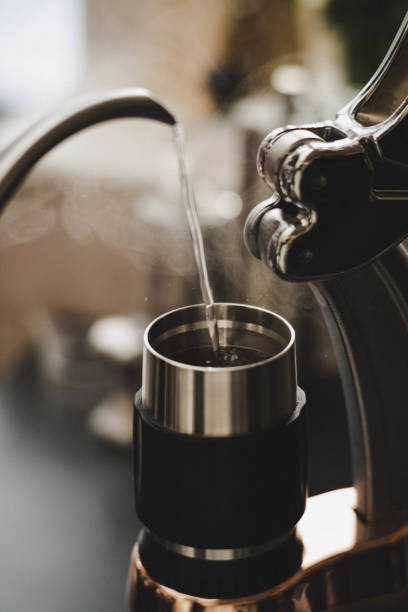 istock close up water pouring into manual espresso machine with vapour 1270935550