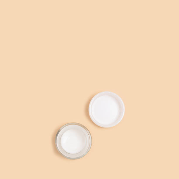 istock Jar of face cream pattern on a beige background. 1270938123