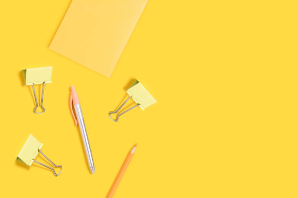 istock School supplies frame on a yellow background. 1270938133