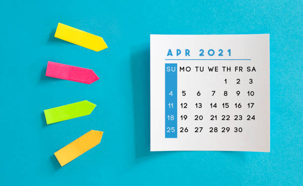 istock April 2021 calendar on a blue background. 1270938135