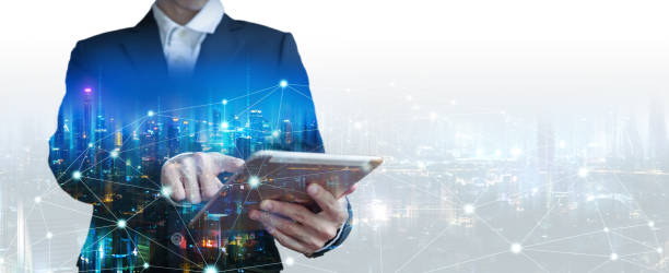istock Double exposure business man using tablet on futuristic network connect city technology background 1270939626