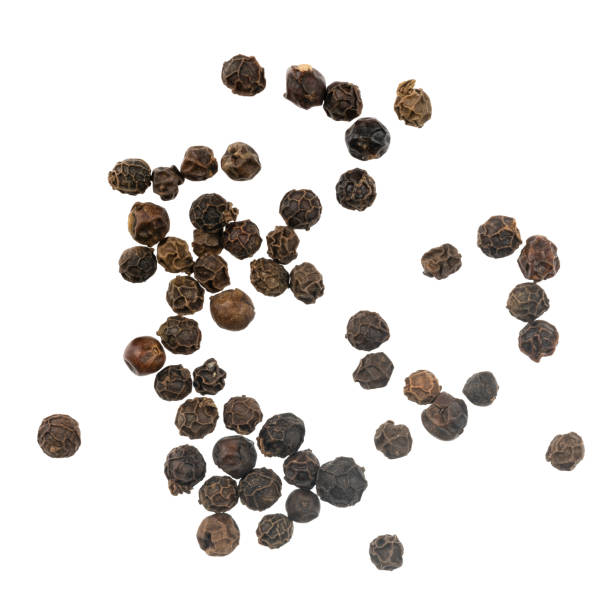 istock Black peppercorns isolated on white background 1270939968