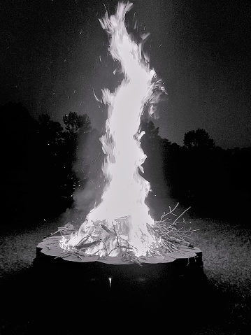 A black and white shot of a burning Lake Sinclair fire pit.