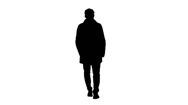 istock Silhouette Man with dark beard in light trench coat walks 1270946273