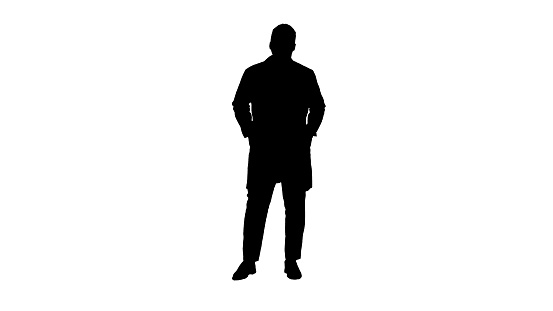 Full length. Silhouette Male African Doctor Standing With Hands In His Pockets. Professional shot in 4K resolution. 012. You can use it e.g. in your commercial video, medical, business, presentation, broadcast