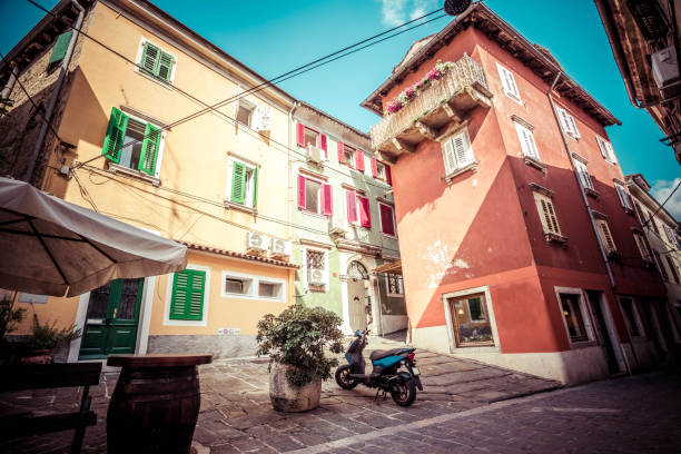 Old town of Koper The old town of Koper (Capo d'Istria) is difficult to acces by car, thus vespa or a scooter is found as the best transportation option. koper slovenia stock pictures, royalty-free photos & images